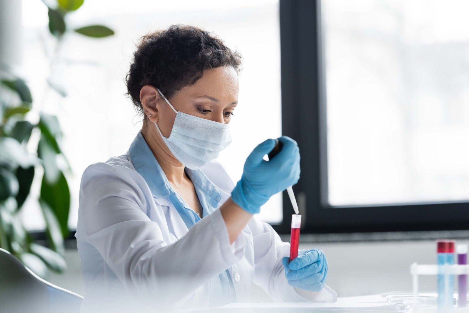 African american scientist in medical mask making 2023 11 27 05 00 52 utc