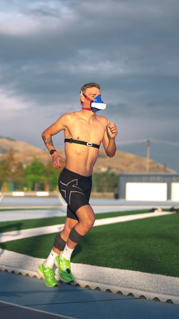 Man jogging while wearing vo2 mask